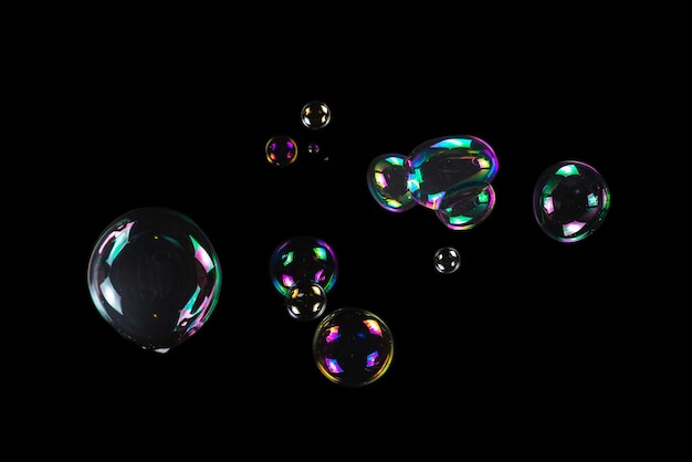 Photo soap bubbles isolated on a black background copy space