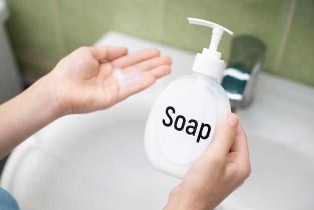 Soap in the hand of a girl before washing hands