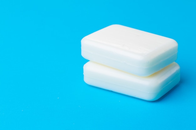 Soap for hand washing on a blue background.