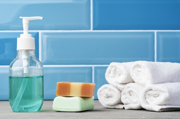 Soap and toiletries on shelf in blue bathroom