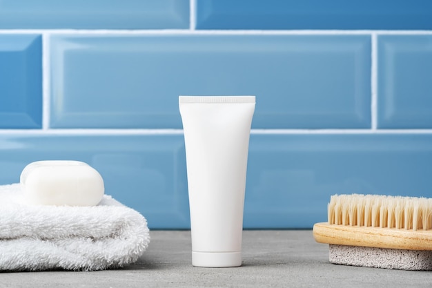 Soap and toiletries on shelf in blue bathroom