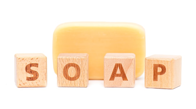 SOAP word by wooden blocks, piece of Soap isolated