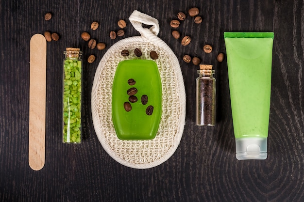 Soaps, bath salt, mask on wood table background. spa