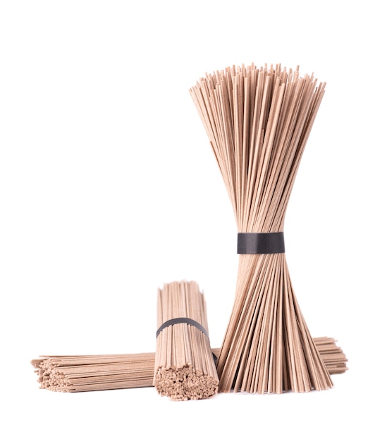 Soba noodles, isolated on white. Bundle of buckwheat japanese soba noodle sticks. Asian food.