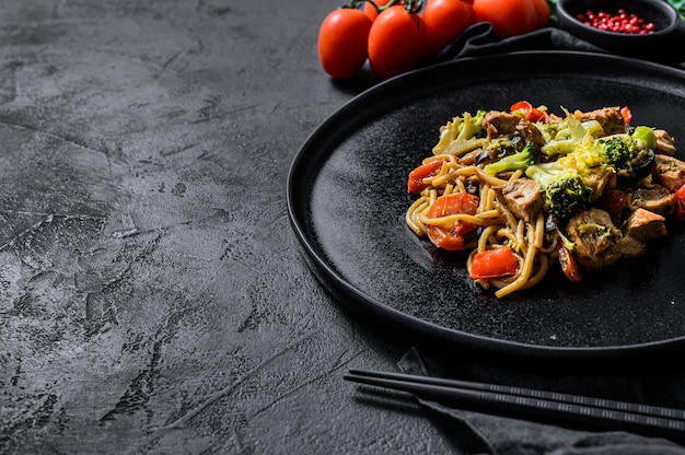 Soba noodles with beef, carrots, onions and sweet peppers.
