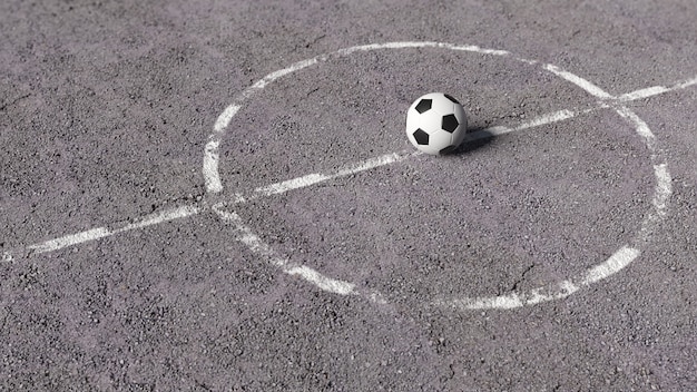 Футбольный мяч на асфальте