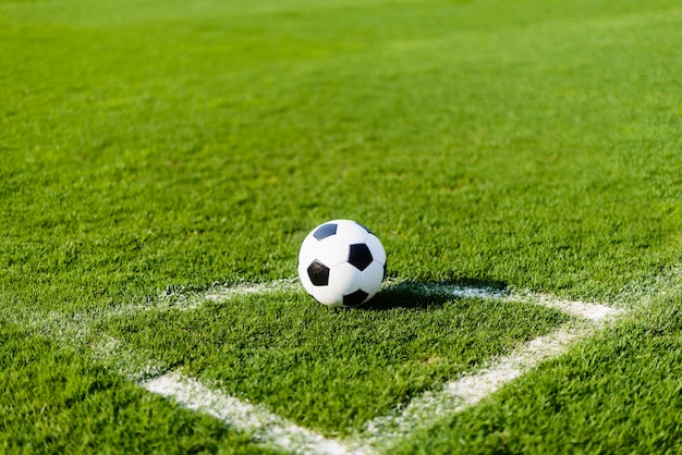 Soccer ball on field corner