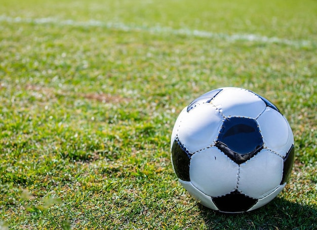 A soccer ball on a field with the word " on it "