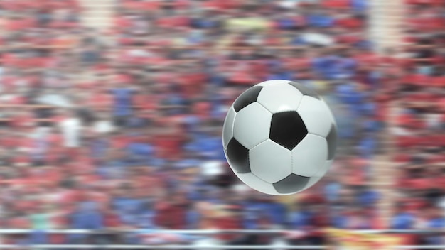 Il pallone da calcio vola in rapido movimento in uno stadio competitivo