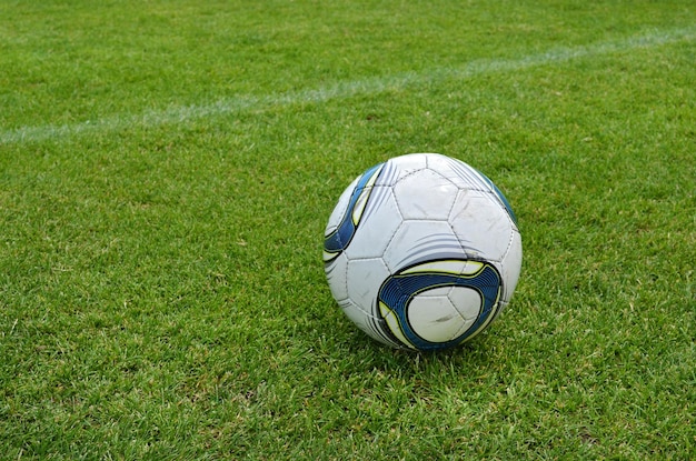 Soccer ball on grass field closeup