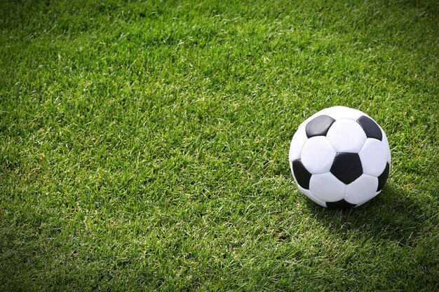 Soccer ball on green field