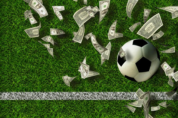 Foto palla da calcio sull'erba verde con banconote di dollari idee di gioco d'azzardo