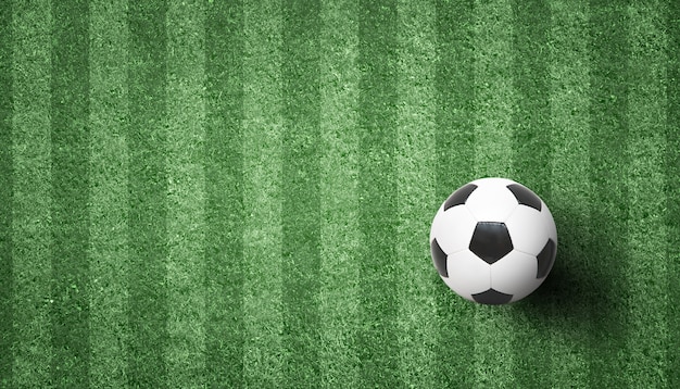 Foto pallone da calcio sul campo da giuoco verde. concetto di calcio