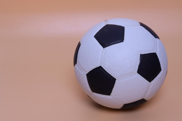 Photo soccer ball isolated on pastel background.