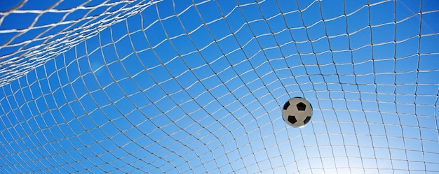 Photo soccer ball in the net of a goal. soccer concept