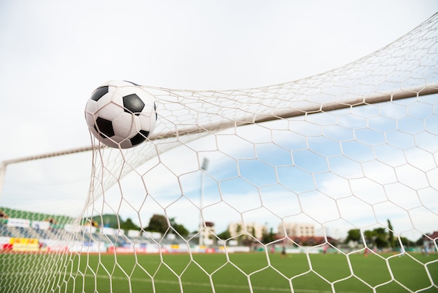 Photo soccer ball in net