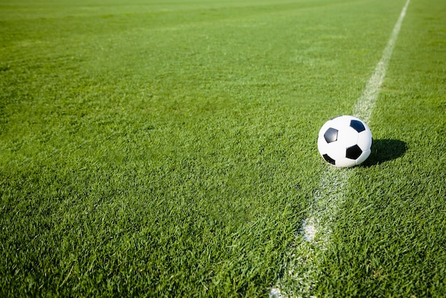 Photo soccer ball on white line