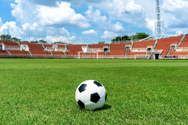 Soccer field, football field, green grass background texture on the athletic stadium