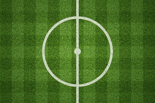 Photo soccer field or football field on green grass background