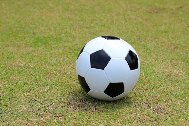 Soccer football on green field