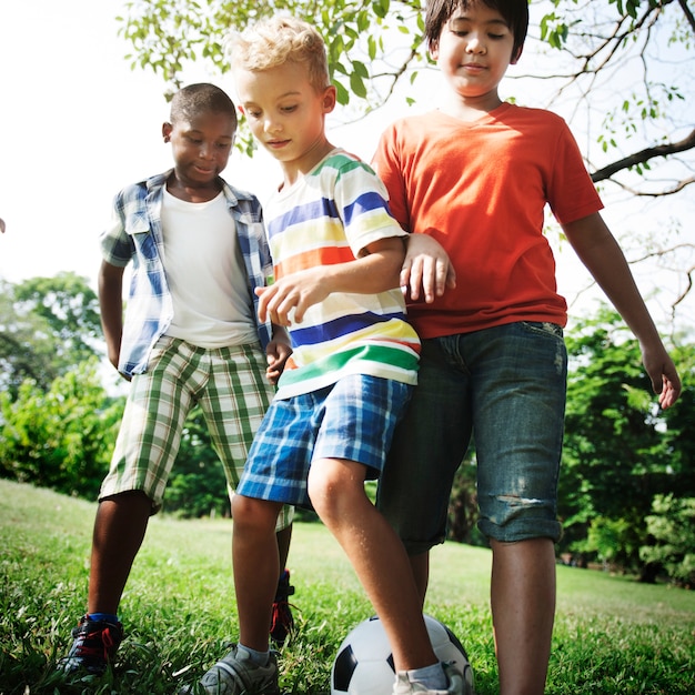 Photo soccer friends boys playful nature offspring concept