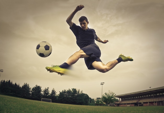 Soccer player kicking a ball