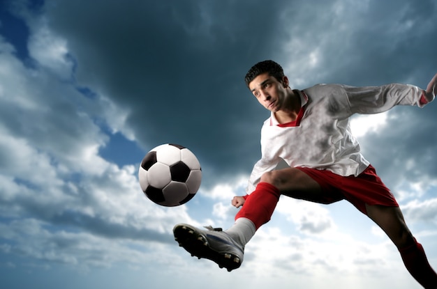 Soccer player kicking a ball