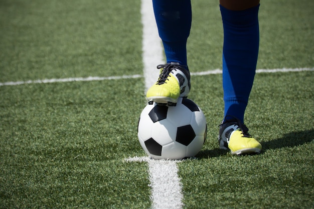 Soccer player's feet on the ball