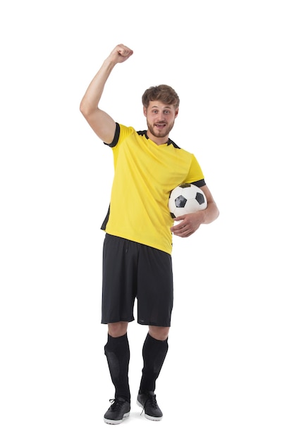 Soccer player with ball on white