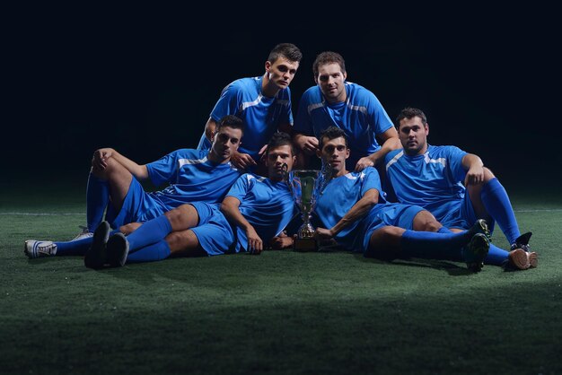 soccer players celebrating victory