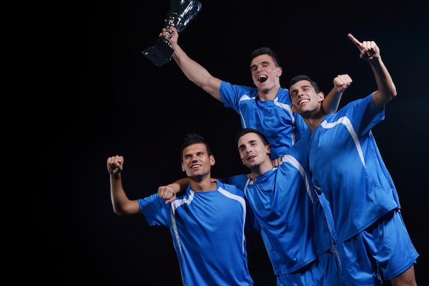 soccer players celebrating victory