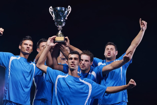 soccer players celebrating victory