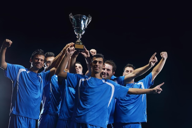 soccer players celebrating victory