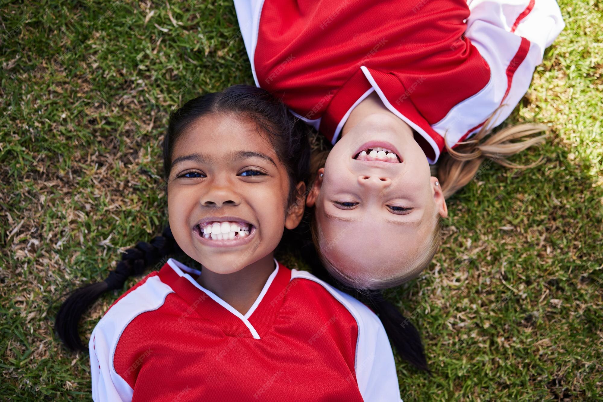 Premium Photo Soccer sports and children with girl friends lying on a