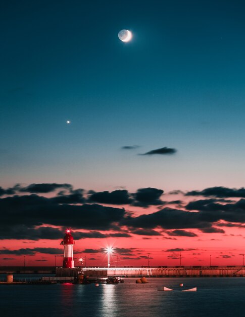 Sochi lighthouse landscape. Sea and moon.