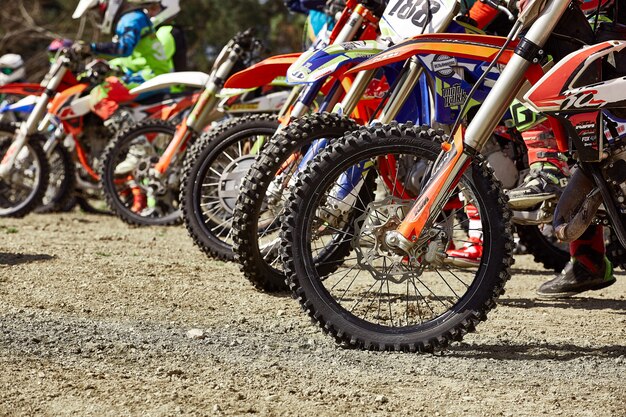 Sochi, Russia - 04.04.2018: young riders on motorcycles at starting line during Cup Winter motocross