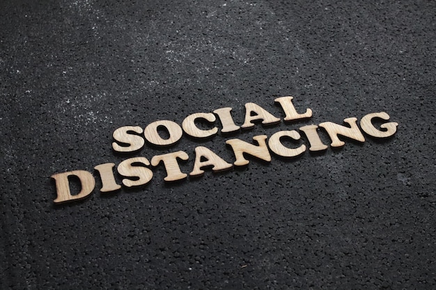 social distancing concept social distance words written with wooden alphabet