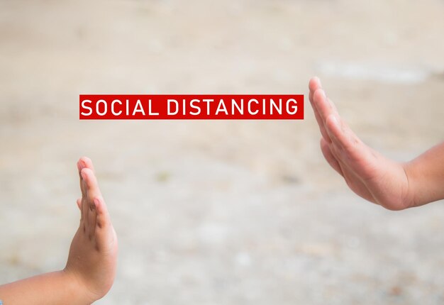 Social distancing and non-contact greetings. Two young children's hands reaching out to touch each other. Concept of public health.