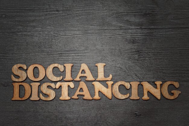 social distancing wooden alphabet words with grunge effect