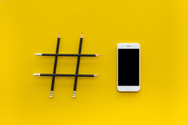 Social media and creativity concepts with hashtag sign made of pencil