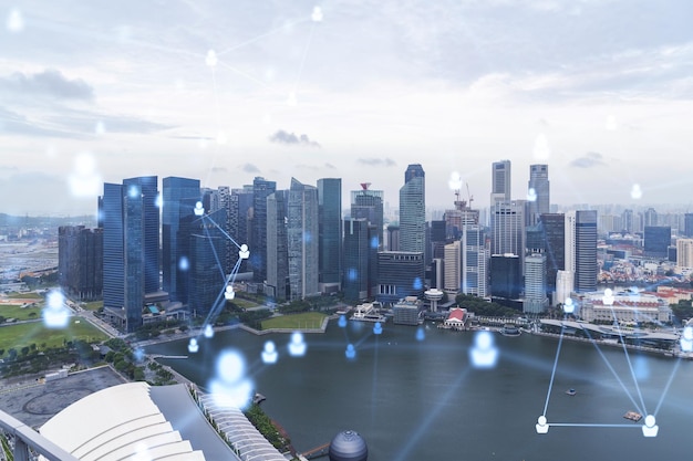 Social media iconen hologram over panorama uitzicht op de stad van Singapore Azië Het concept van mensen netwerkverbindingen en carrièremogelijkheden Dubbele blootstelling