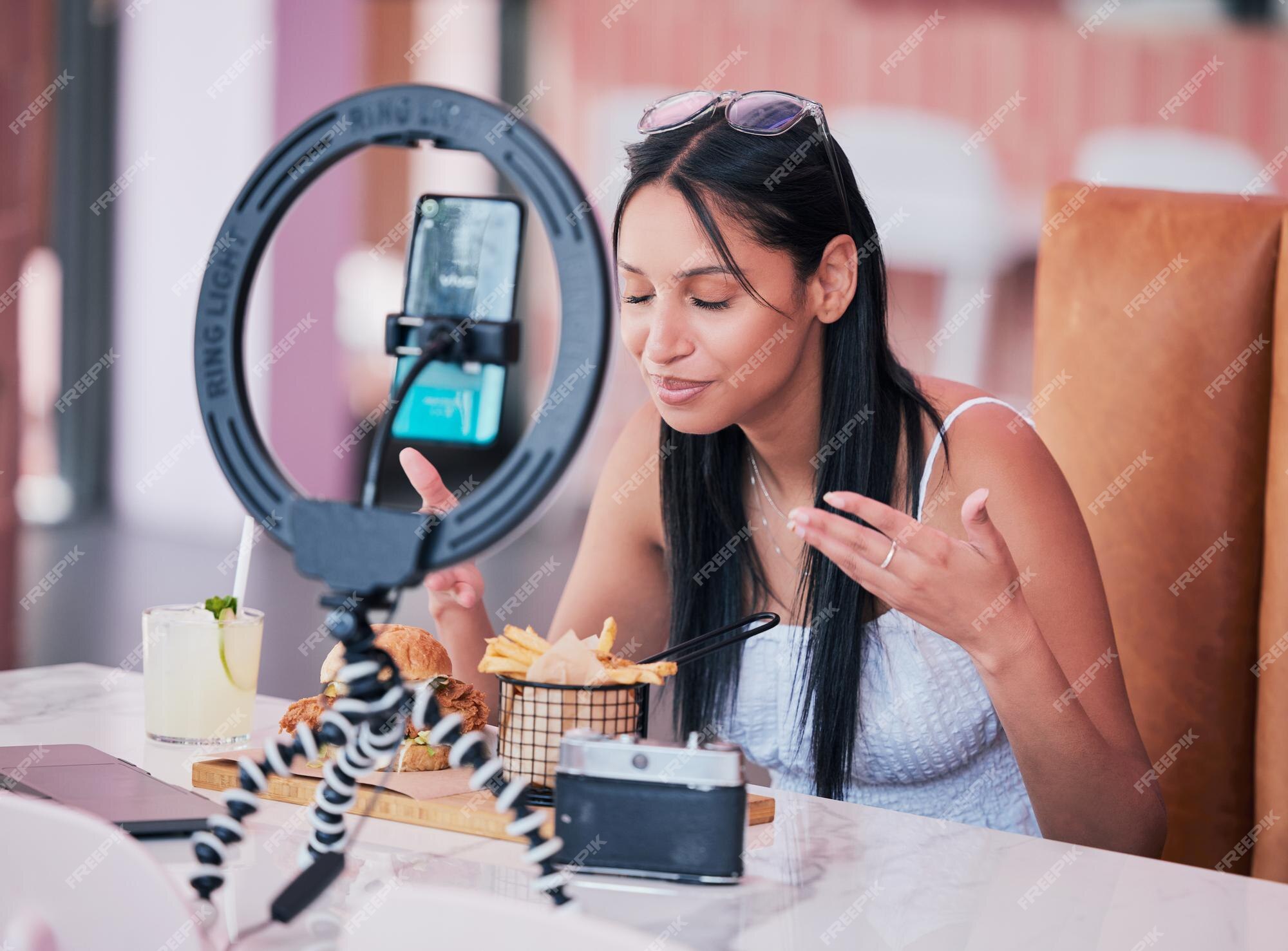 Premium Photo Social media influencer smartphone and ring light for new fast food restaurant test for internet web and followers creative online communication with digital mobile tech for startup video blog