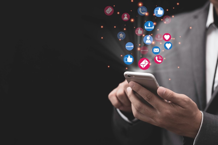 Photo social media and marketing concept with businessman holding smartphone