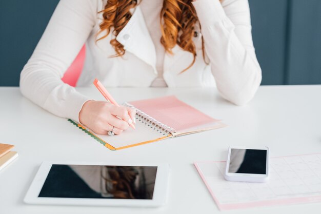 social media marketing. smm expert woman scheduling job. agenda priorities. 