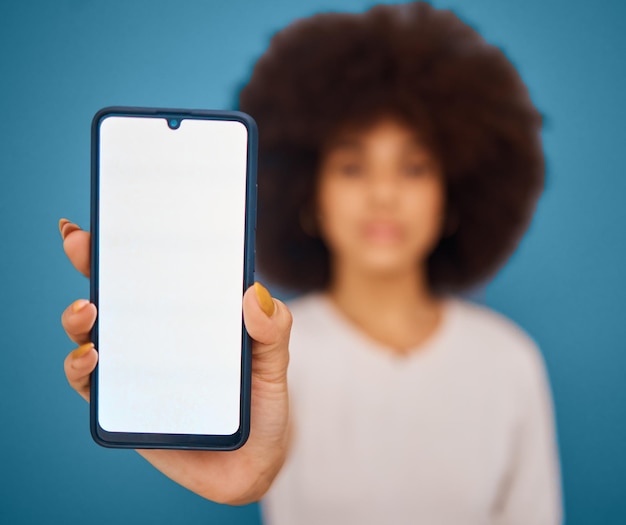 Social media mockup and woman with phone on green screen for marketing advertising and product placement Hand digital and afro girl with blank screen for branding information or communication