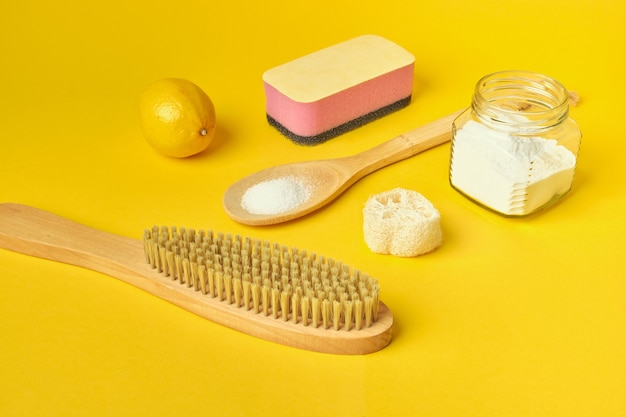 soda brush lemon sponge and loofah on yellow background Zero waste concept