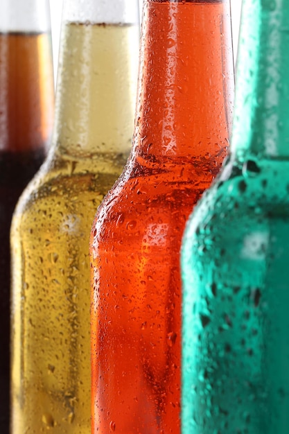 Photo soda drinks with cola and beer in bottles