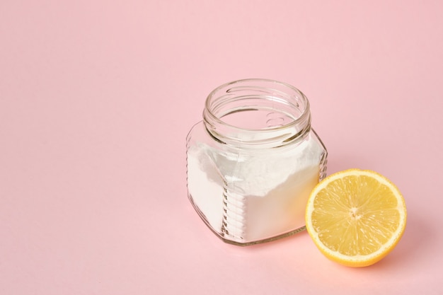soda and lemon on pink background copy space eco friendly cleaning concept