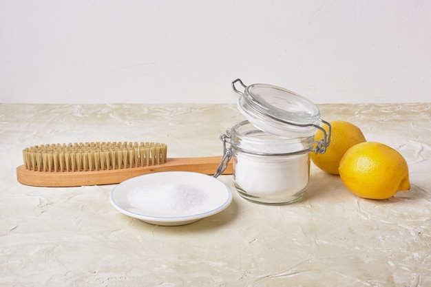 Soda lemons sponge and wooden brush eco cleaning concept