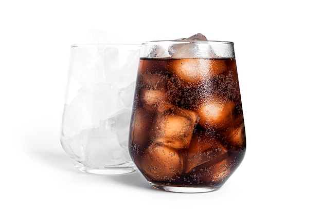 Soda with ice in a transparent glass isolated. Glass with ice and glass with soda.